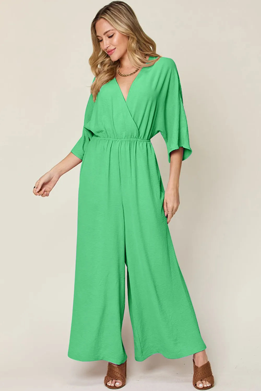 Double Take Full Size Surplice Wide Leg Jumpsuit with Pockets by Trendsi